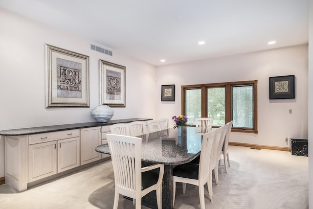dining area with light carpet