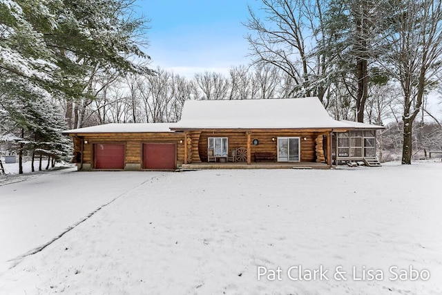 view of snow covered garage