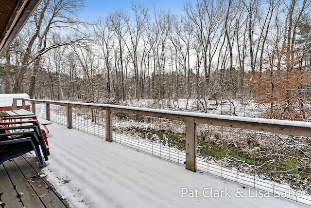 view of snow covered deck