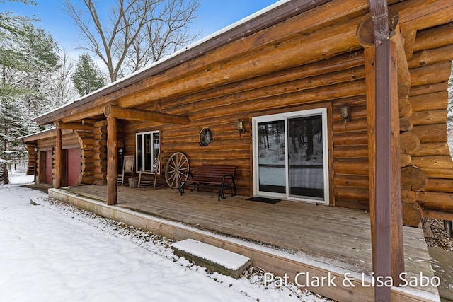 view of snow covered deck