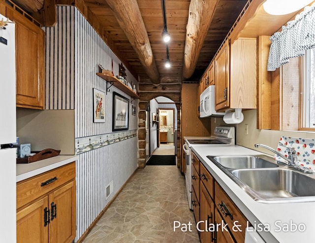 kitchen featuring wood ceiling, white appliances, sink, decorative light fixtures, and beamed ceiling