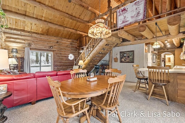 carpeted dining area with log walls, lofted ceiling with beams, and wooden ceiling