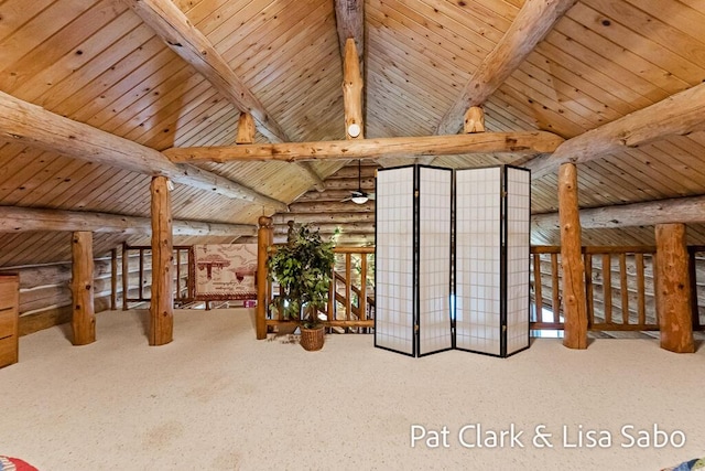 interior space with carpet, vaulted ceiling with beams, rustic walls, and wooden ceiling