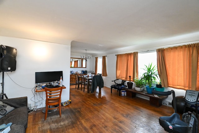 living room featuring dark hardwood / wood-style flooring and a notable chandelier