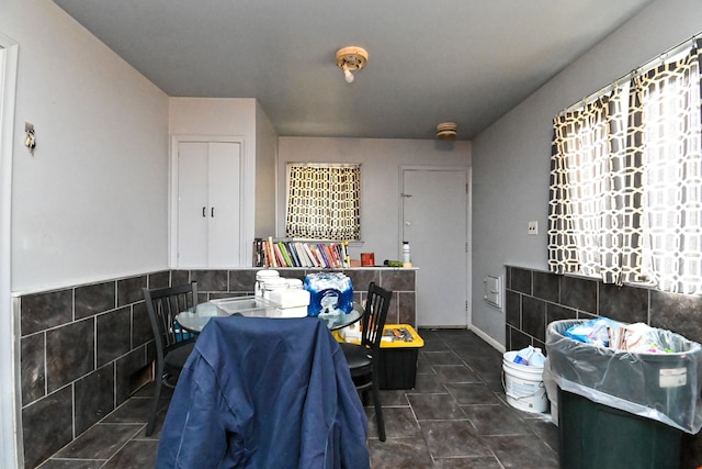 bathroom with tile walls