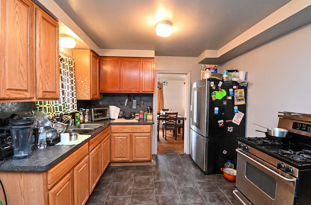 kitchen with backsplash, sink, and stainless steel appliances