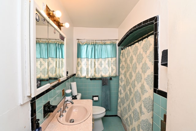 bathroom featuring a shower with curtain, vanity, toilet, and tile walls