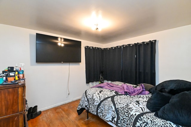 bedroom featuring hardwood / wood-style floors