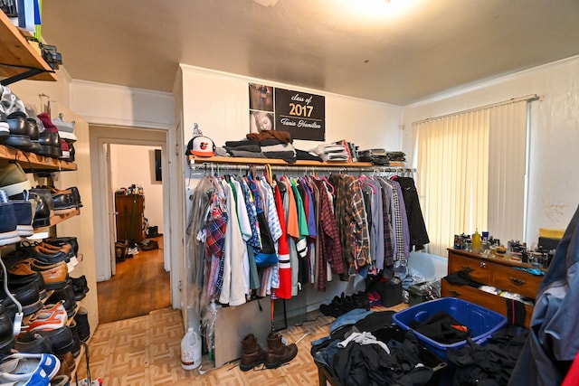 walk in closet featuring light parquet flooring