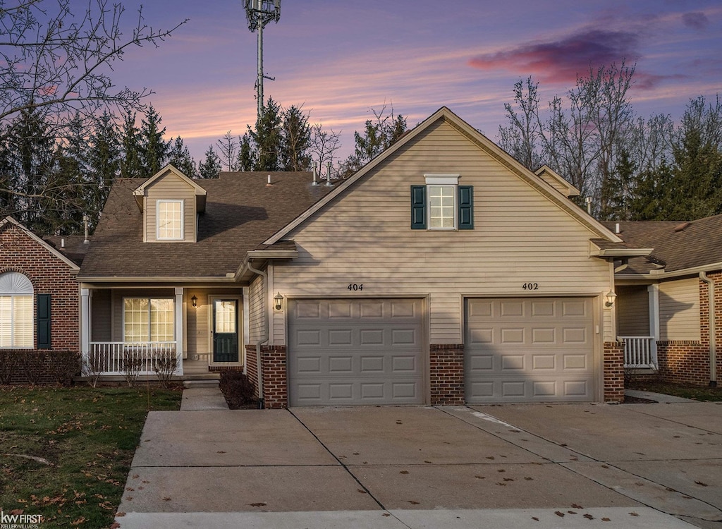 view of front of home with a garage and covered porch