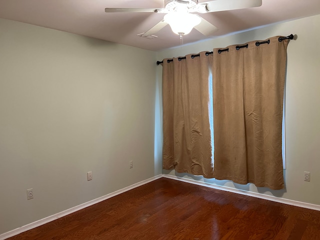 empty room featuring ceiling fan and wood-type flooring