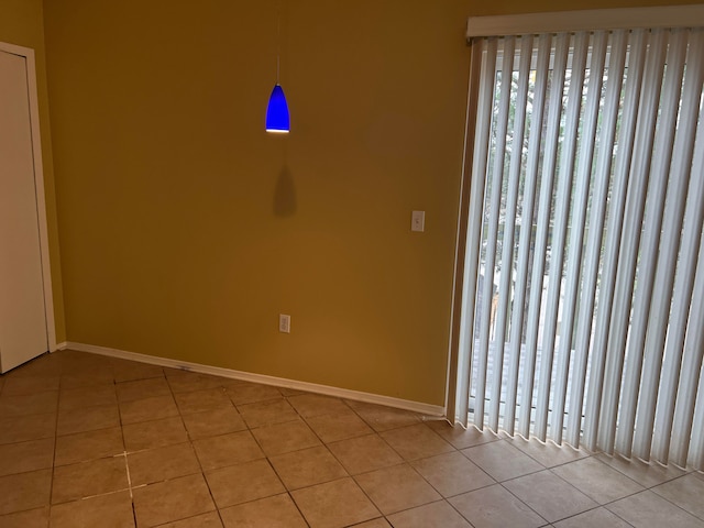 empty room with light tile patterned floors