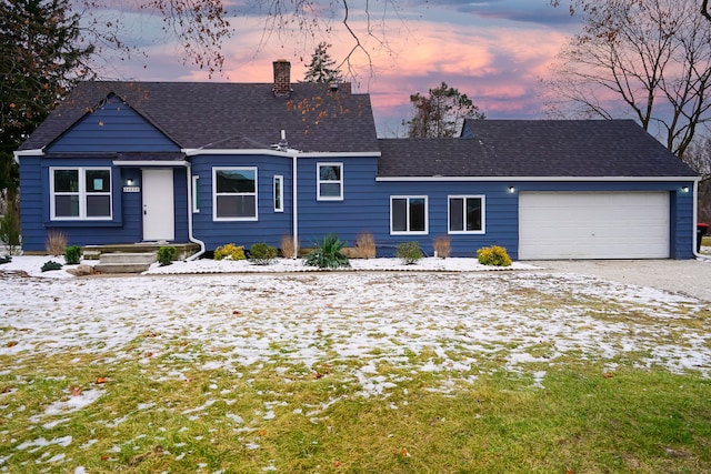 single story home with a garage