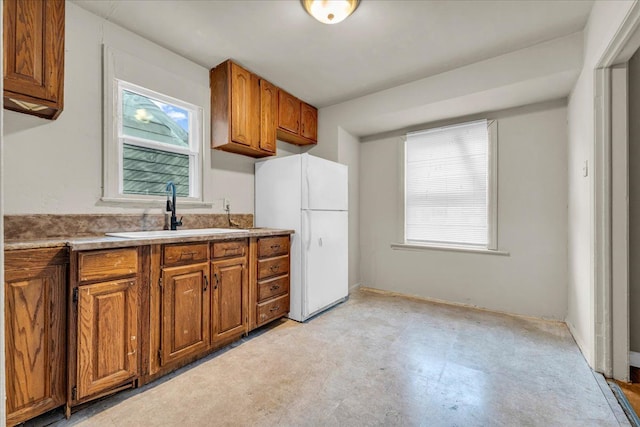 kitchen with white fridge and sink