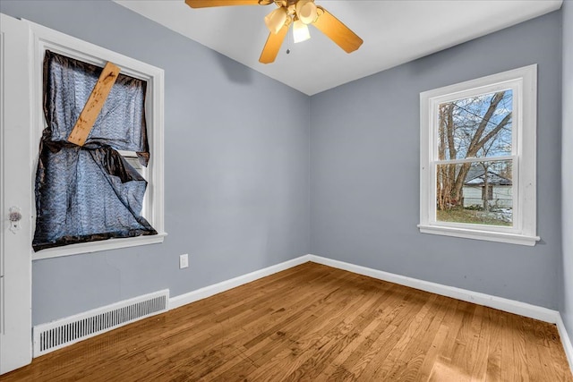 spare room with ceiling fan and hardwood / wood-style floors