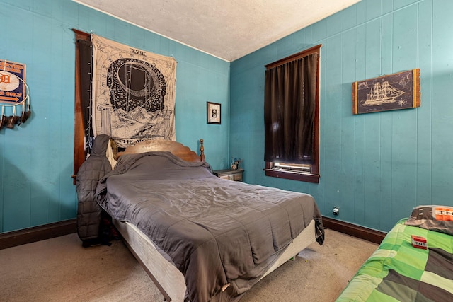 bedroom featuring carpet and a textured ceiling