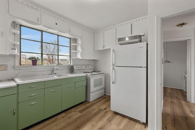 kitchen with light wood-type flooring, white appliances, white cabinetry, and sink