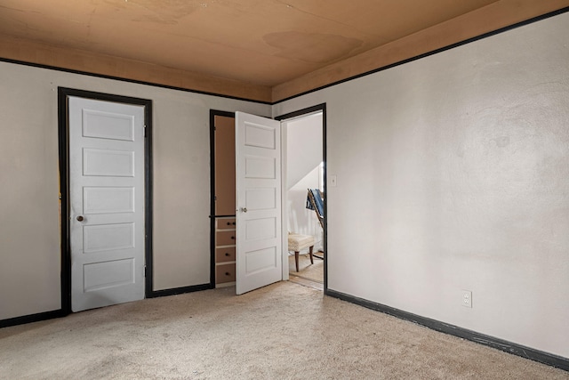 unfurnished bedroom featuring light colored carpet