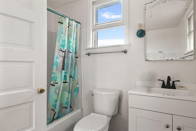 full bathroom with vanity, shower / tub combo, and toilet