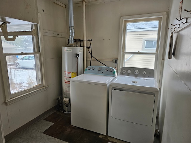 washroom featuring washer and dryer and water heater