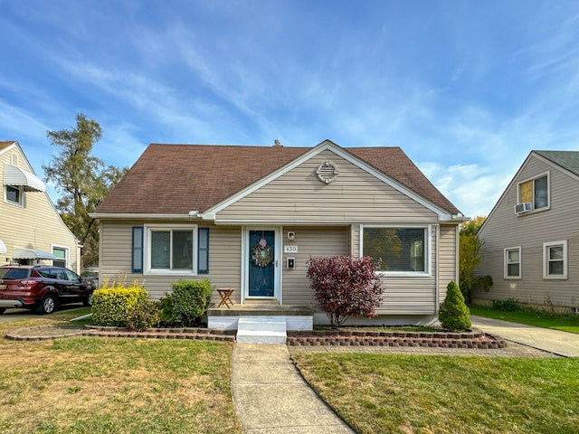 bungalow with a front yard