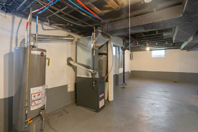 basement with gas water heater and heating unit