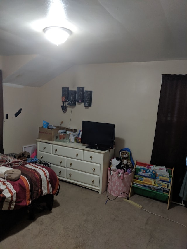 carpeted bedroom with vaulted ceiling