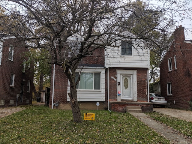 front facade with a front lawn