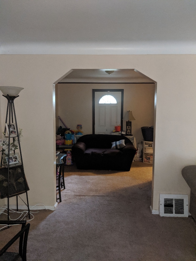 view of carpeted foyer