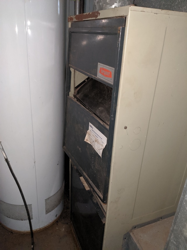 utility room featuring gas water heater