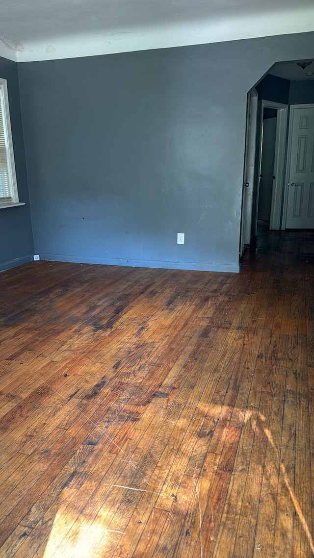 spare room featuring dark hardwood / wood-style floors