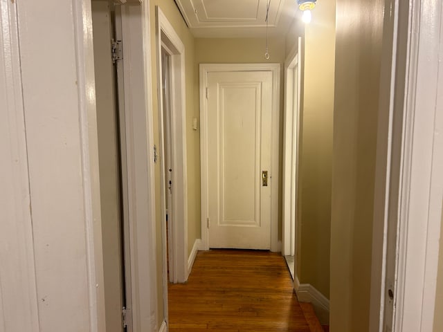 hall with dark hardwood / wood-style flooring