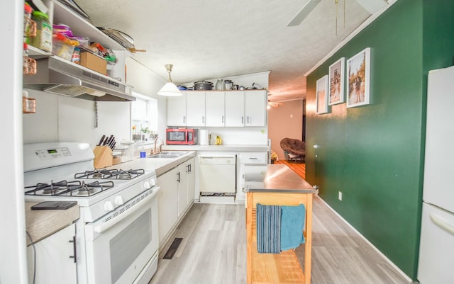 kitchen featuring white cabinetry, pendant lighting, a textured ceiling, white appliances, and light hardwood / wood-style floors