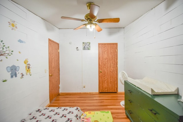 bedroom with ceiling fan and light wood-type flooring