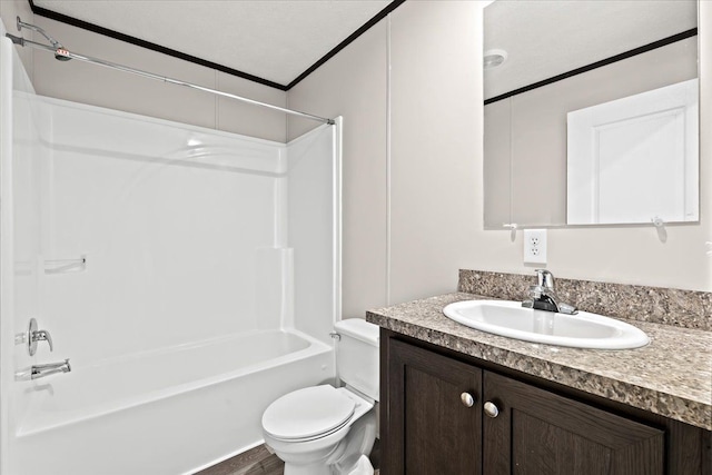 full bathroom with washtub / shower combination, hardwood / wood-style floors, toilet, vanity, and ornamental molding