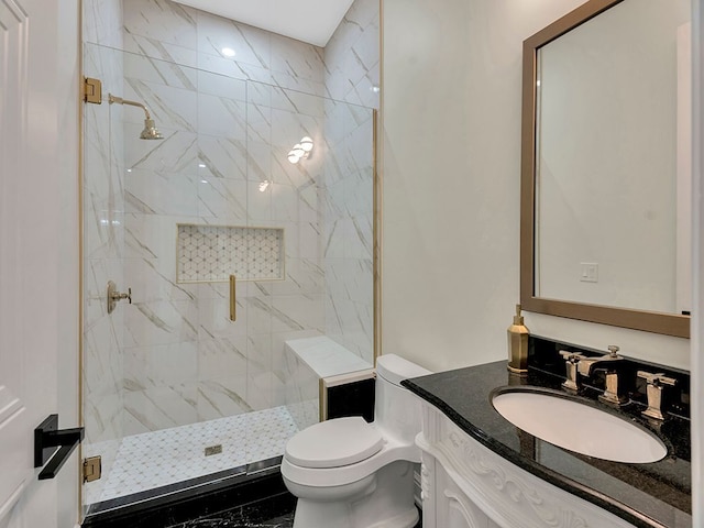 bathroom featuring vanity, toilet, and a shower with door