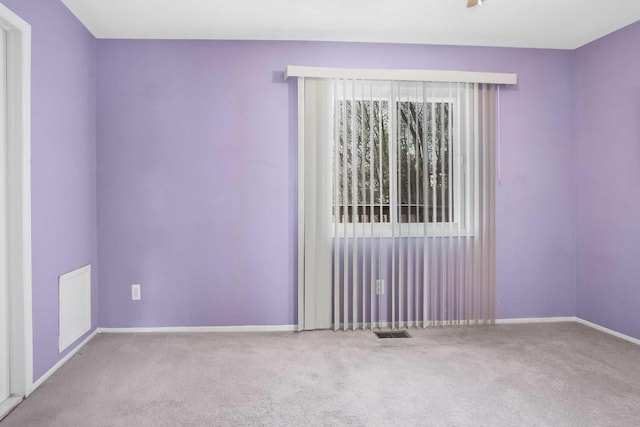 view of carpeted spare room