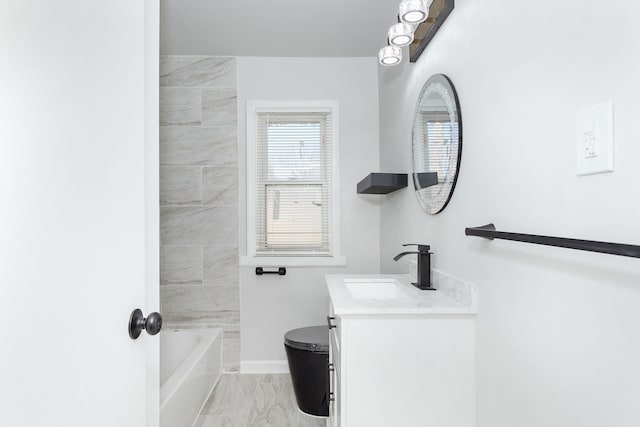 full bathroom with tiled shower / bath, vanity, and toilet