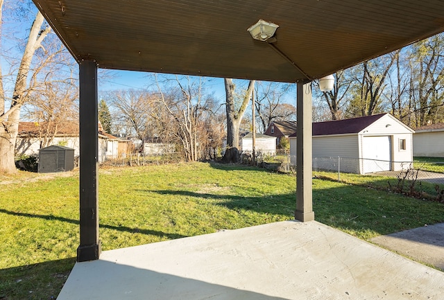 view of yard with a patio and a storage unit