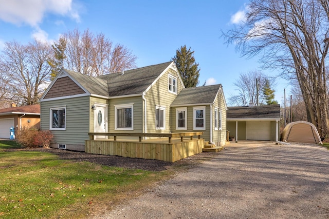 view of front of property with a garage and a front yard