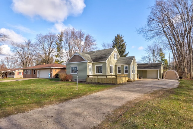 view of front of property with a garage and a front lawn