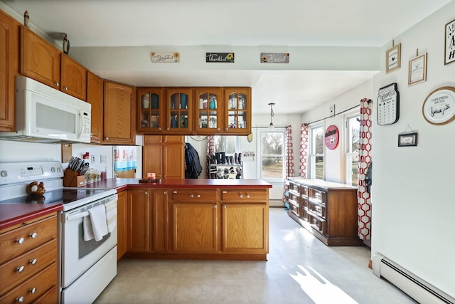 kitchen featuring a baseboard heating unit, pendant lighting, white appliances, and kitchen peninsula