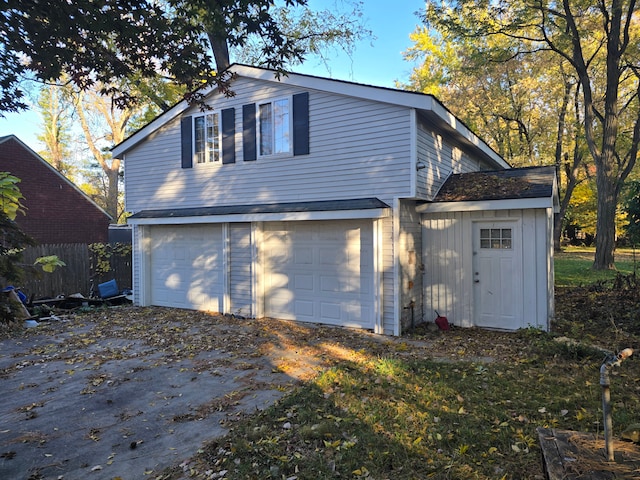 view of property exterior with a garage