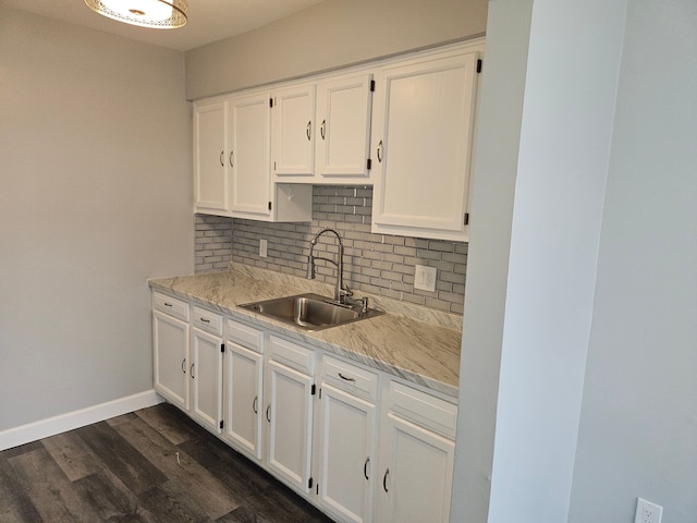 kitchen featuring white cabinets, dark hardwood / wood-style flooring, and sink