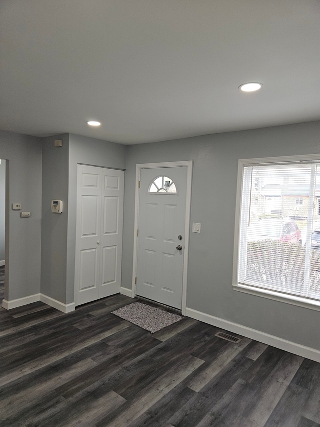 foyer with dark hardwood / wood-style floors