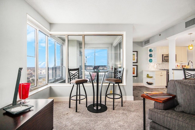 dining space with a healthy amount of sunlight and light hardwood / wood-style flooring