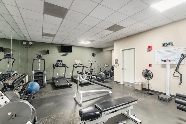 workout area featuring a paneled ceiling