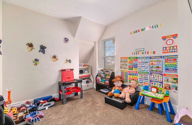 playroom with carpet flooring and lofted ceiling