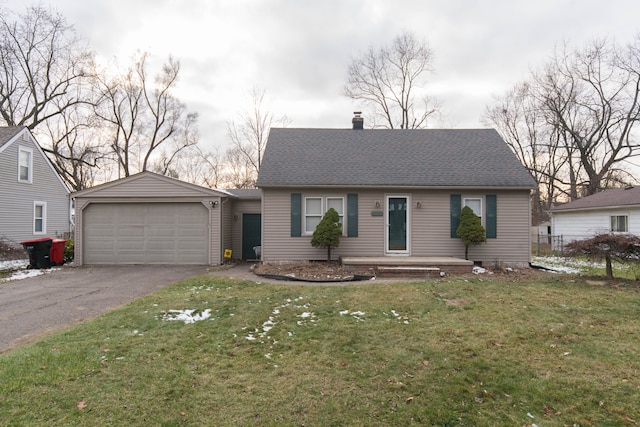 view of front of house featuring a front yard and a garage