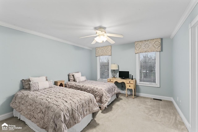 carpeted bedroom with ceiling fan and crown molding